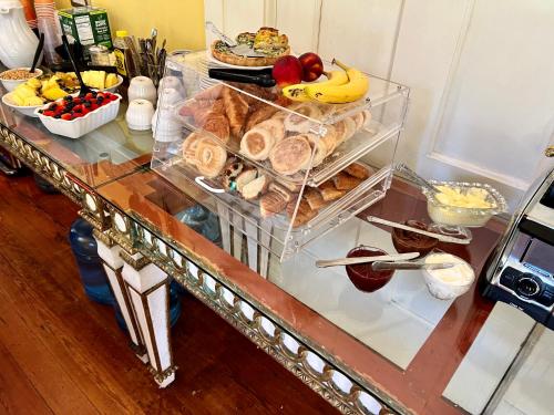 a table with a bunch of food on it at Creole Gardens Guesthouse and Inn in New Orleans