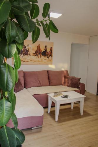 a living room with a couch and a table at Villa Bali - Aladinici in Stolac