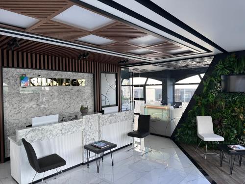 a lobby with a bar with chairs and a counter at STAR SUIT HOTEL in Trabzon