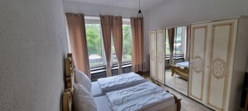 a bedroom with a bed and a large mirror at Moselblick in Kinheim