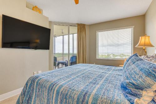 a bedroom with a bed and a large window at Perdido Key Condo with Views and Golf Club Access! in Pensacola