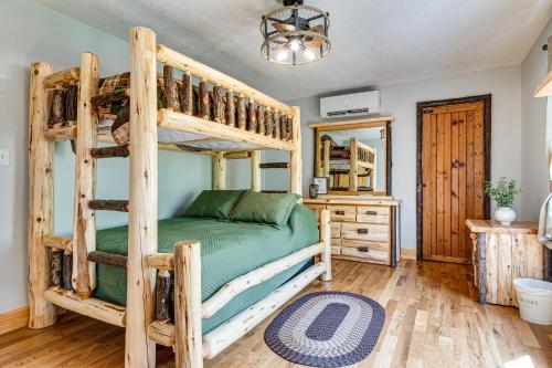 a bedroom with a wooden bunk bed and a mirror at Family-Friendly Milton Home on 14 Acres with Hot Tub in Milton