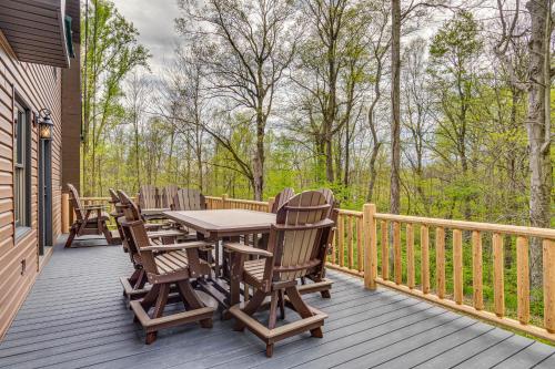 a wooden deck with a table and chairs on it at Family-Friendly Milton Home on 14 Acres with Hot Tub in Milton