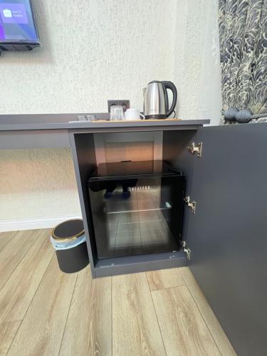 a desk with a tea kettle on top of it at Feycem Suites&Hotel in Istanbul