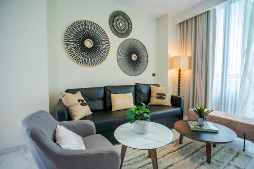 a living room with a couch and two chairs at Xeliter Cana Rock Punta Cana in Punta Cana