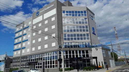 a large office building with a lot of windows at Hotel San Marinho in União da Vitória
