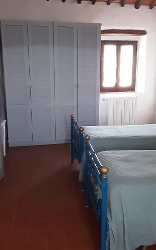 Ένα ή περισσότερα κρεβάτια σε δωμάτιο στο Celle di lecchi nel Chianti