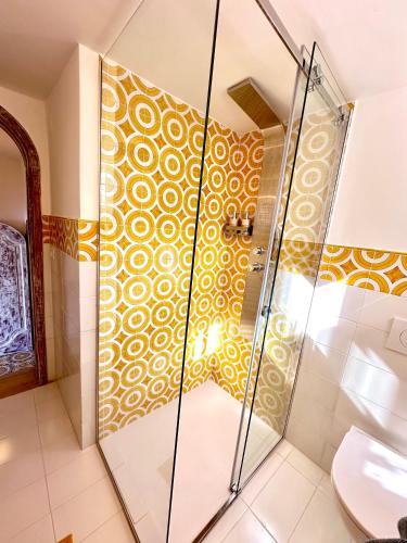a bathroom with a shower and a toilet at Casalbivio Positano in Positano