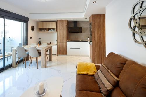 a living room with a couch and a table at Eco-Torrevieja in Torrevieja