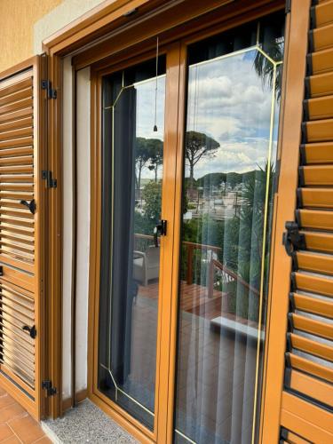 a sliding glass door with a view of a patio at Villa Verde Vlore in Vlorë