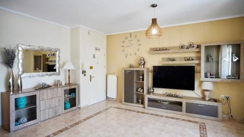 a large living room with a flat screen tv at LOVELY AND SUNNY APARTAMENT 300m FROM BEACH!! in Perea