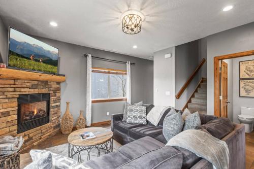 a living room with a couch and a fireplace at Bear Hollow Village 5458 by Moose Management in Park City