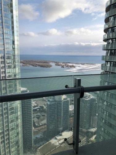 a view of the ocean from the top of a building at One bed plus Den Downtown Toronto in Toronto