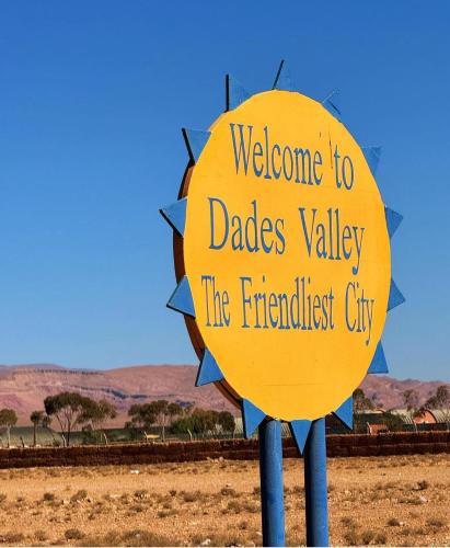 a yellow sign that says welcome to dades valley the frustrated city at Hôtel Restaurant BOUGAFER in Oulad Akkou