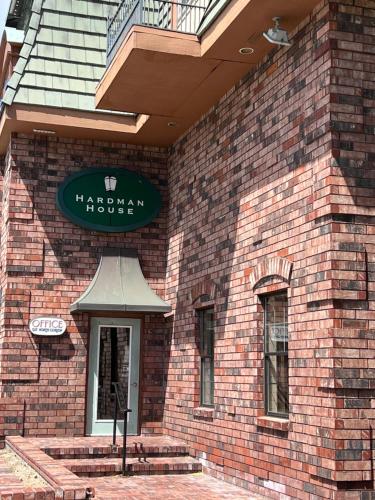 a brick building with a sign on top of it at Hardman House in Carson City