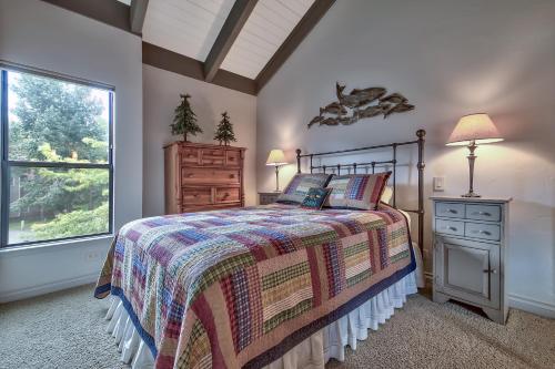 a bedroom with a bed and a window at Lakeland Village 610 Lakefront Beauty On Water in South Lake Tahoe