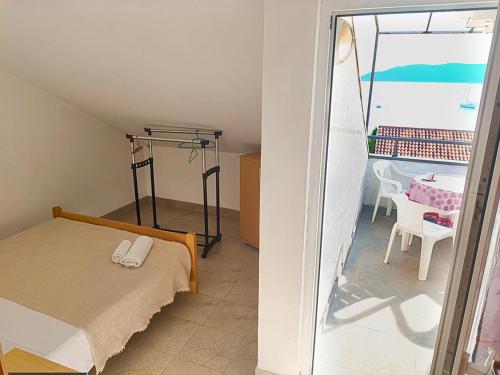 Postel nebo postele na pokoji v ubytování Amisos Apartmani