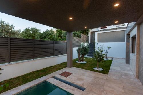 a house with a swimming pool in a yard at Marje Villas Bodrum in Bodrum City