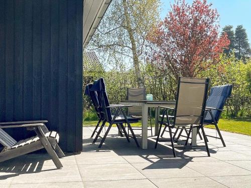a table and chairs sitting on a patio at 8 person holiday home in Dannemare-By Traum in Dannemare