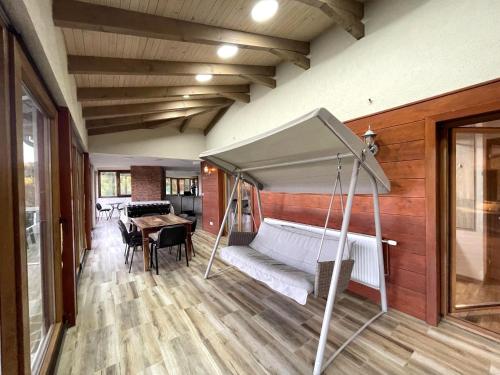 a bedroom with a bed and a table in a room at Villa Sarajevo in Vareš