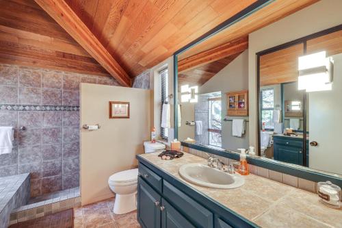 a bathroom with a sink and a toilet at 1 Mi to Lake Tahoe Home with Hot Tub and Decks in Tahoe City