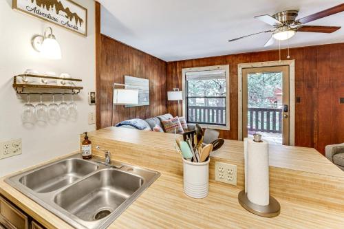 a kitchen with a sink and a counter at Rustic Angel Fire Condo Resort Shuttle On-Site! in Angel Fire