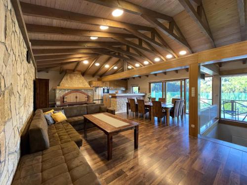 a living room with a couch and a table at Villa Sarajevo in Vareš