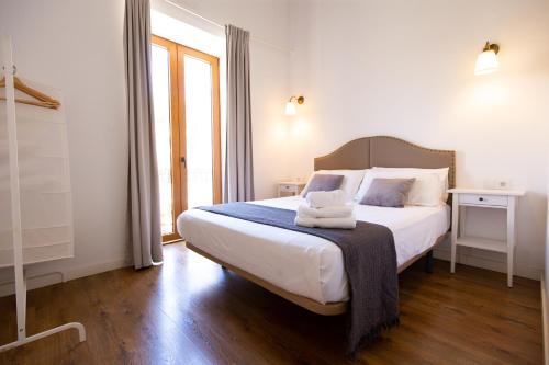 Ένα ή περισσότερα κρεβάτια σε δωμάτιο στο Denia Loft