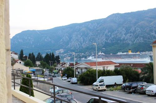 a view of a city with a cruise ship at Art GuestHouse in Kotor
