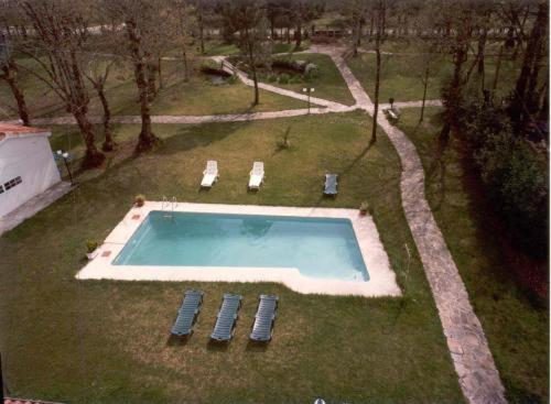 an aerial view of a swimming pool in a park at Hotel San Vicente in Santiago de Compostela