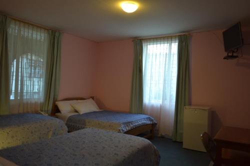 Postel nebo postele na pokoji v ubytování Travellers Inn