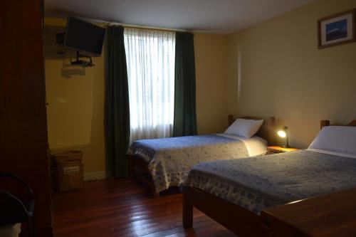 Postel nebo postele na pokoji v ubytování Travellers Inn