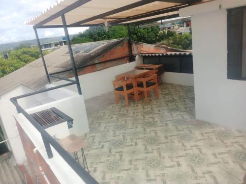 a view from the balcony of a house with a table and chairs at CASA VACACIONAL SAMARIA in Flandes