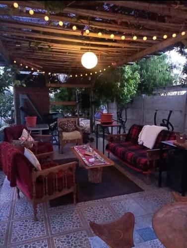 a living room with couches and a table at Cabañas Toto Península Beach in Totoralillo