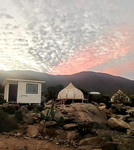a house with a tent on top of a mountain at Cabañas Toto Península Beach in Totoralillo