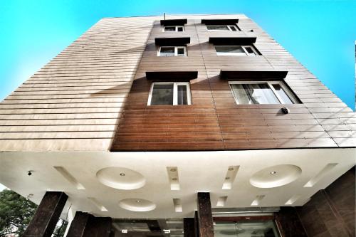 a tall building with windows on the side of it at Airport Hotel Delhi Aerocity, Near Yashobhoomi in New Delhi