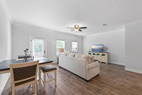 a living room with a couch and a table at Sound Haven Coastal Escape in Navarre
