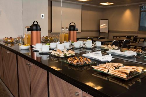 a buffet with several plates of food on a table at Holiday Inn Express - Antofagasta by IHG in Antofagasta