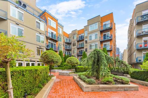 a courtyard in a apartment complex with buildings at Belltown Perch, explore like a local 99 Walkscore in Seattle