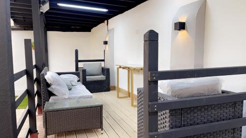 a room with two bunk beds and a chair at The Lux Ville, Stunning 6 Bedroom Home in London in Plumstead