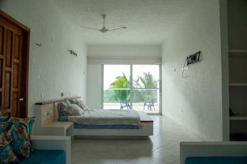Posteľ alebo postele v izbe v ubytovaní Tolu ,Turismocolombia-fit