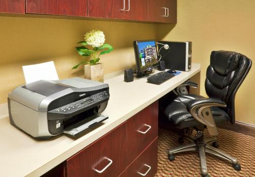an office with a printer and a computer on a desk at Holiday Inn Express Hotel & Suites Birmingham - Inverness 280 by IHG in Birmingham