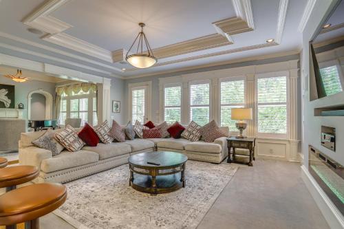 a living room with a couch and a table at Buford Mansion with Pool about 14 Mi to Lake Lanier in Buford