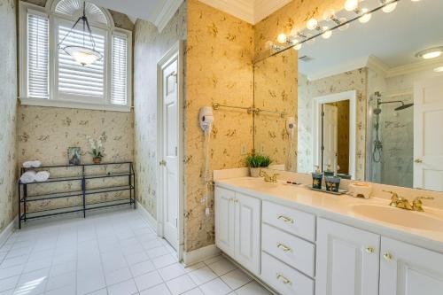 a bathroom with a sink and a shower and a mirror at Buford Mansion with Pool about 14 Mi to Lake Lanier in Buford