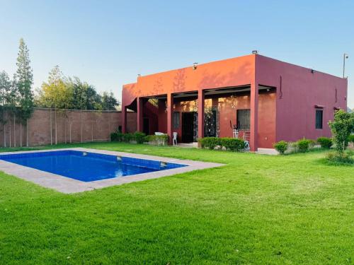 a house with a swimming pool in a yard at Villa Salah in Marrakech