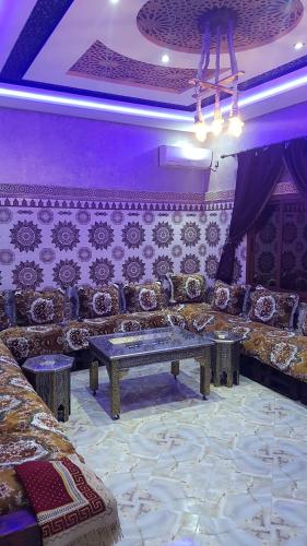 a living room with a couch and a table at Villa Salah in Marrakech