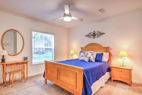 a bedroom with a bed and a mirror and a window at Arete Stay in Austin