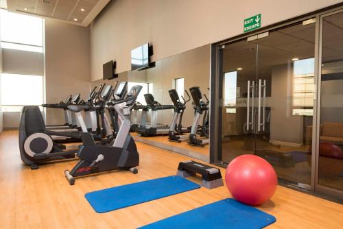 a gym with a bunch of exercise equipment in it at Holiday Inn Express - Concepcion by IHG in Concepción