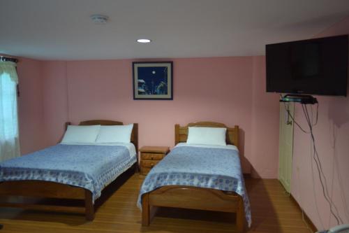 Postel nebo postele na pokoji v ubytování Travellers Inn