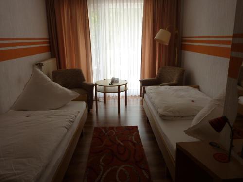 Postel nebo postele na pokoji v ubytování Hotel Oranien